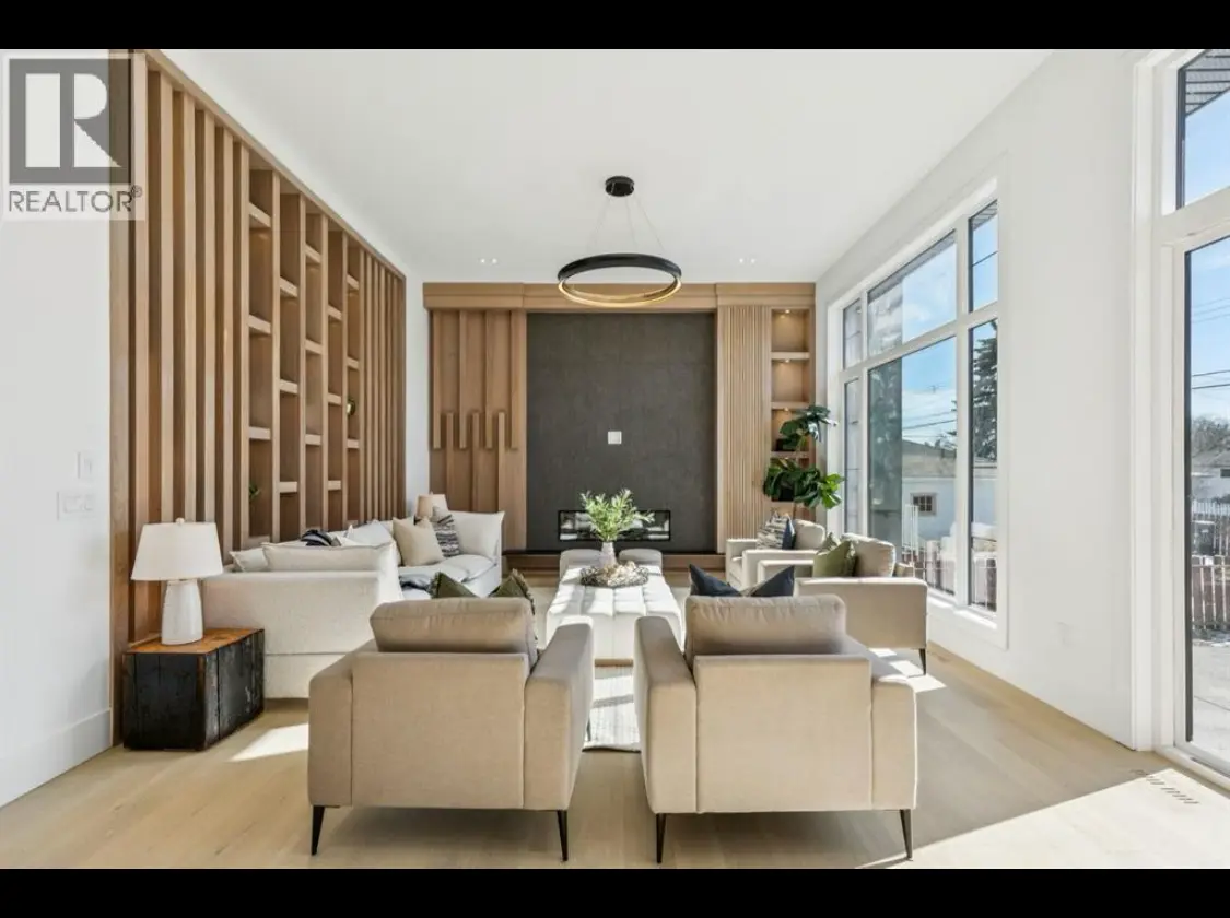 Luxury home staging featuring cream sofas, plush ottoman, and warm decor in a modern living room