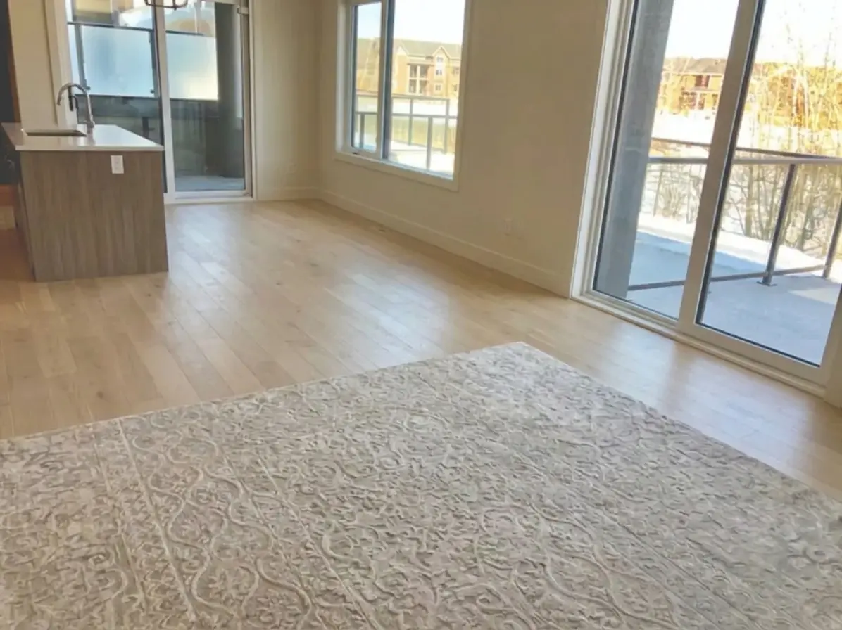 Before staging in an empty Calgary apartment with city views