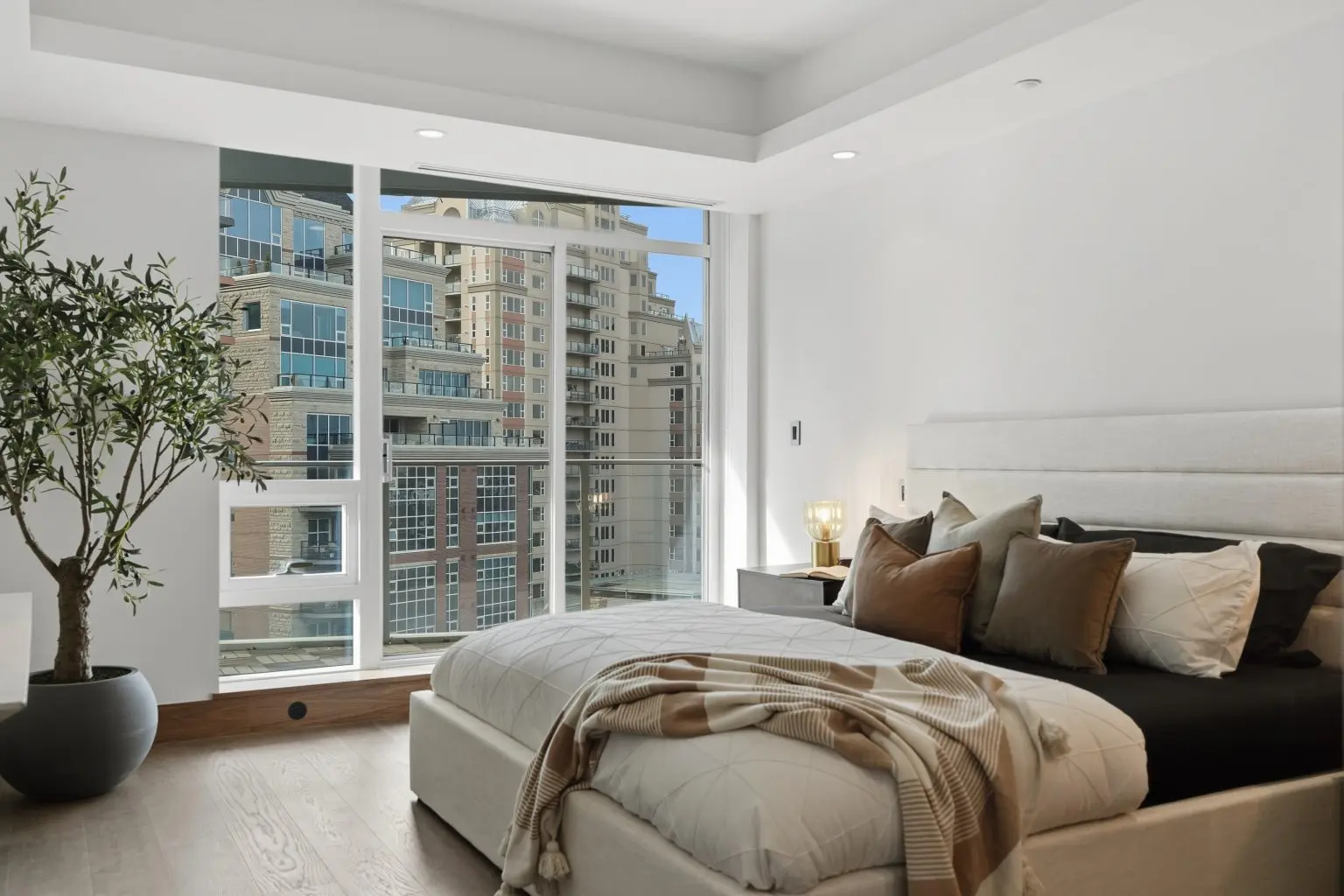Home builder staging services Calgary bedroom with professionally selected furniture